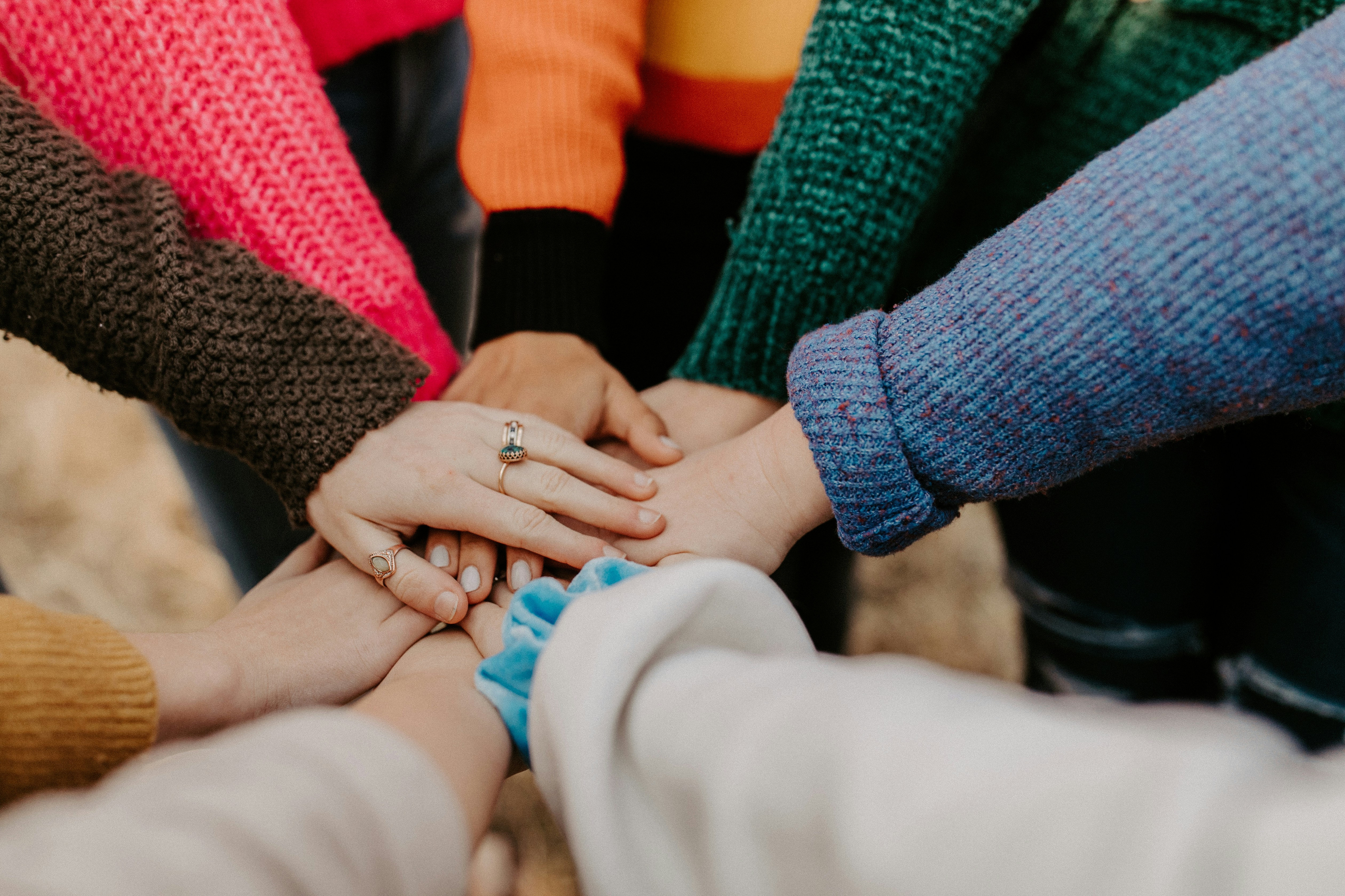 Community members joining hands in support