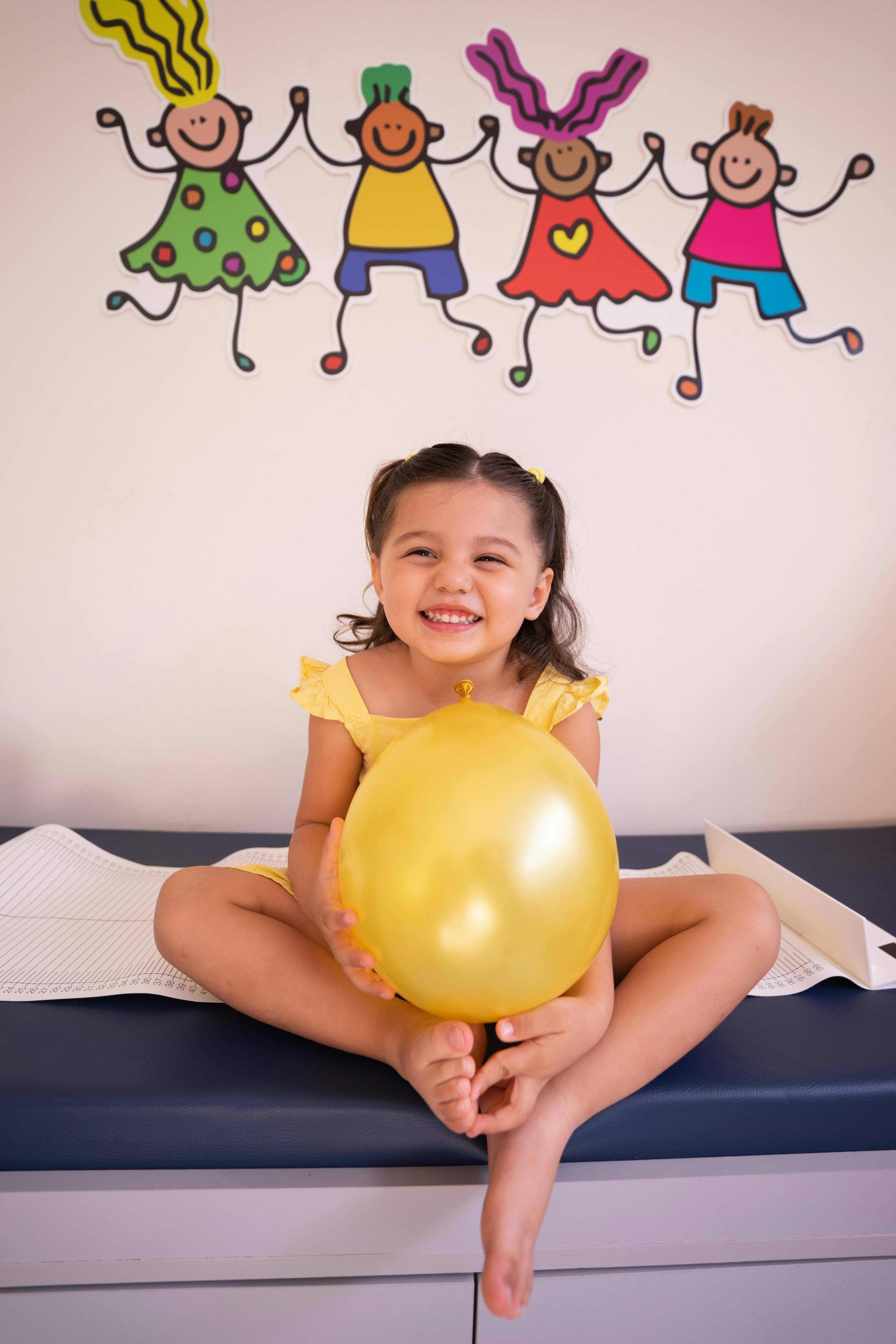 Girl smiling at a pediatric clinic