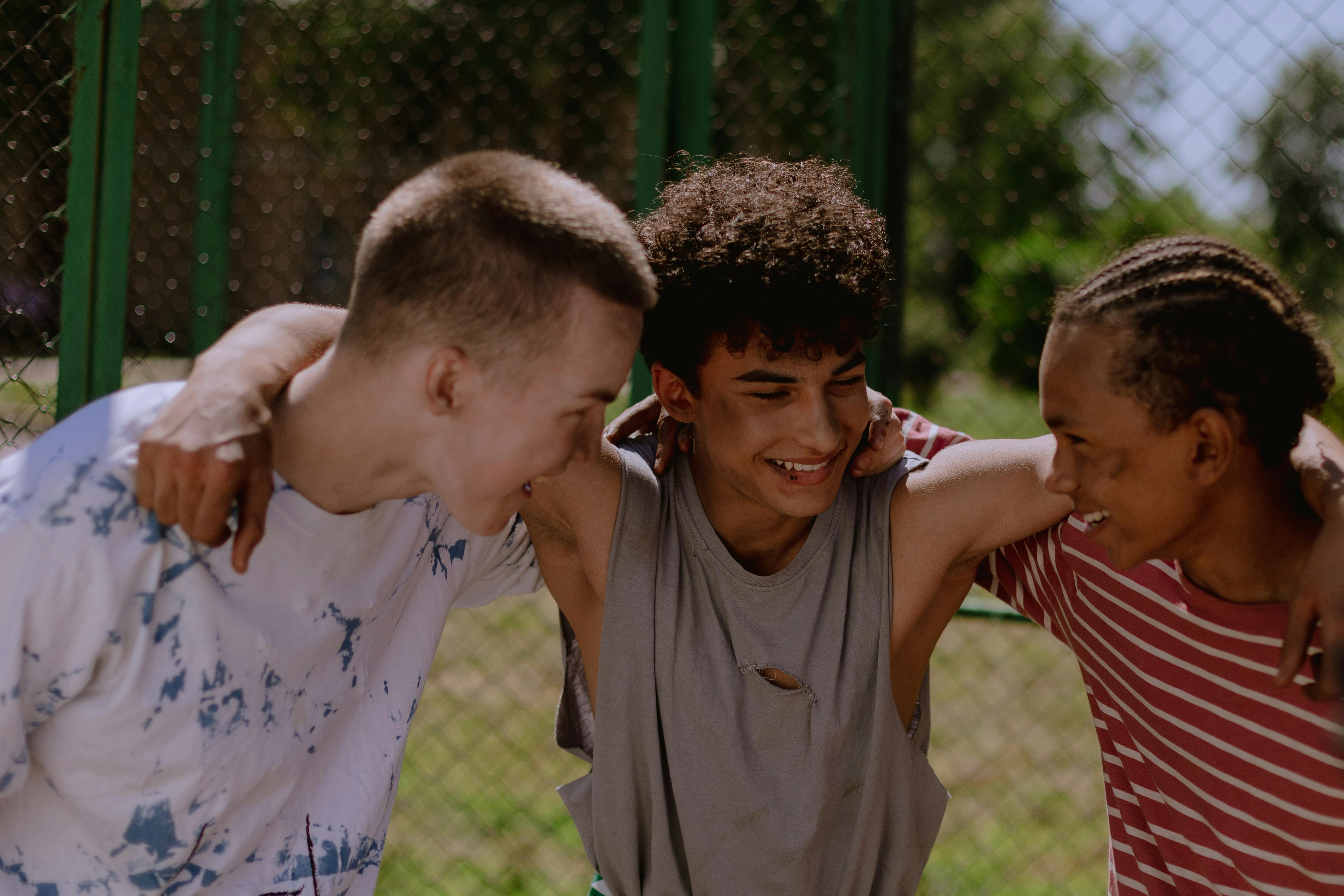 Young people with arms around each other