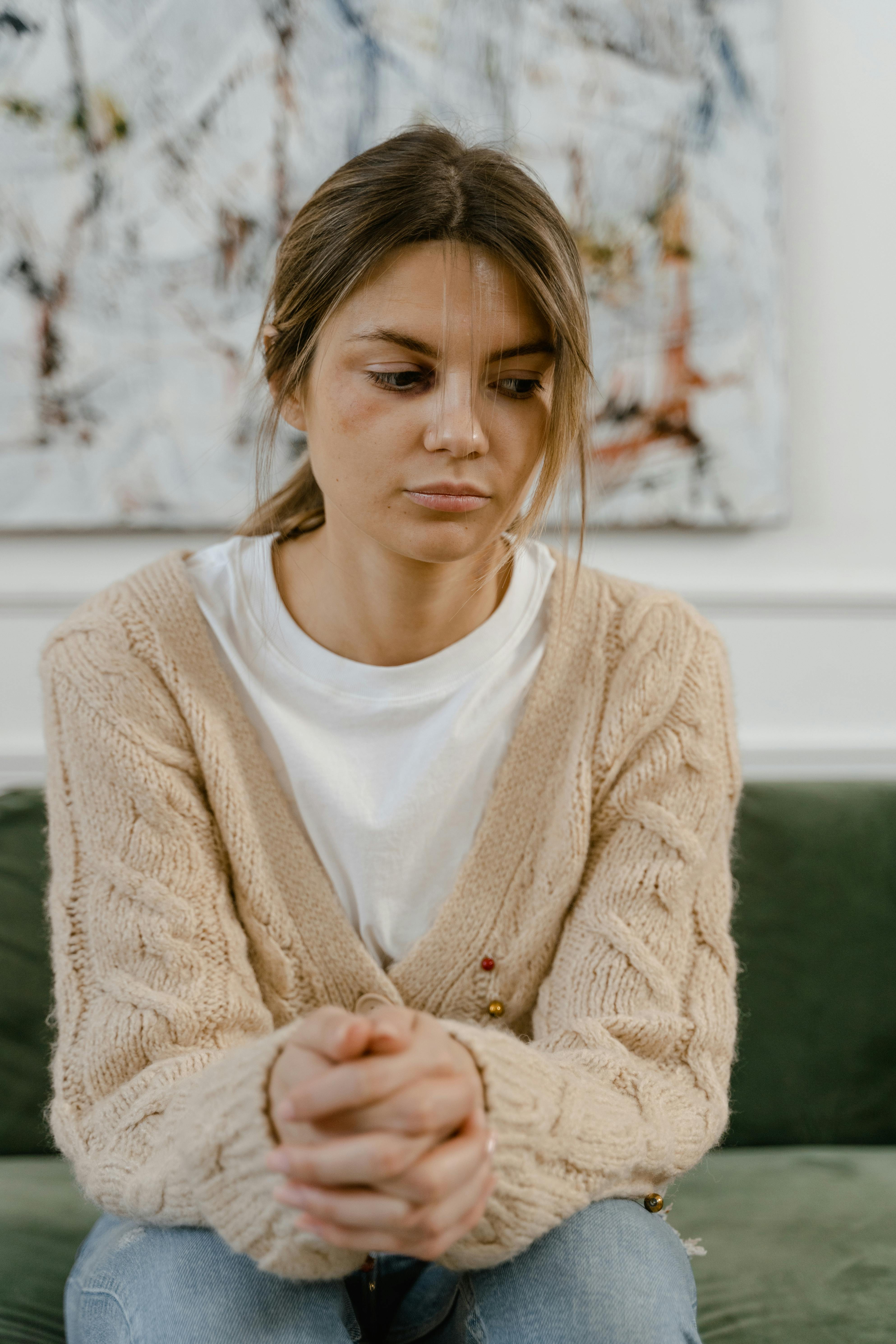 Woman sitting quietly, processing her thoughts